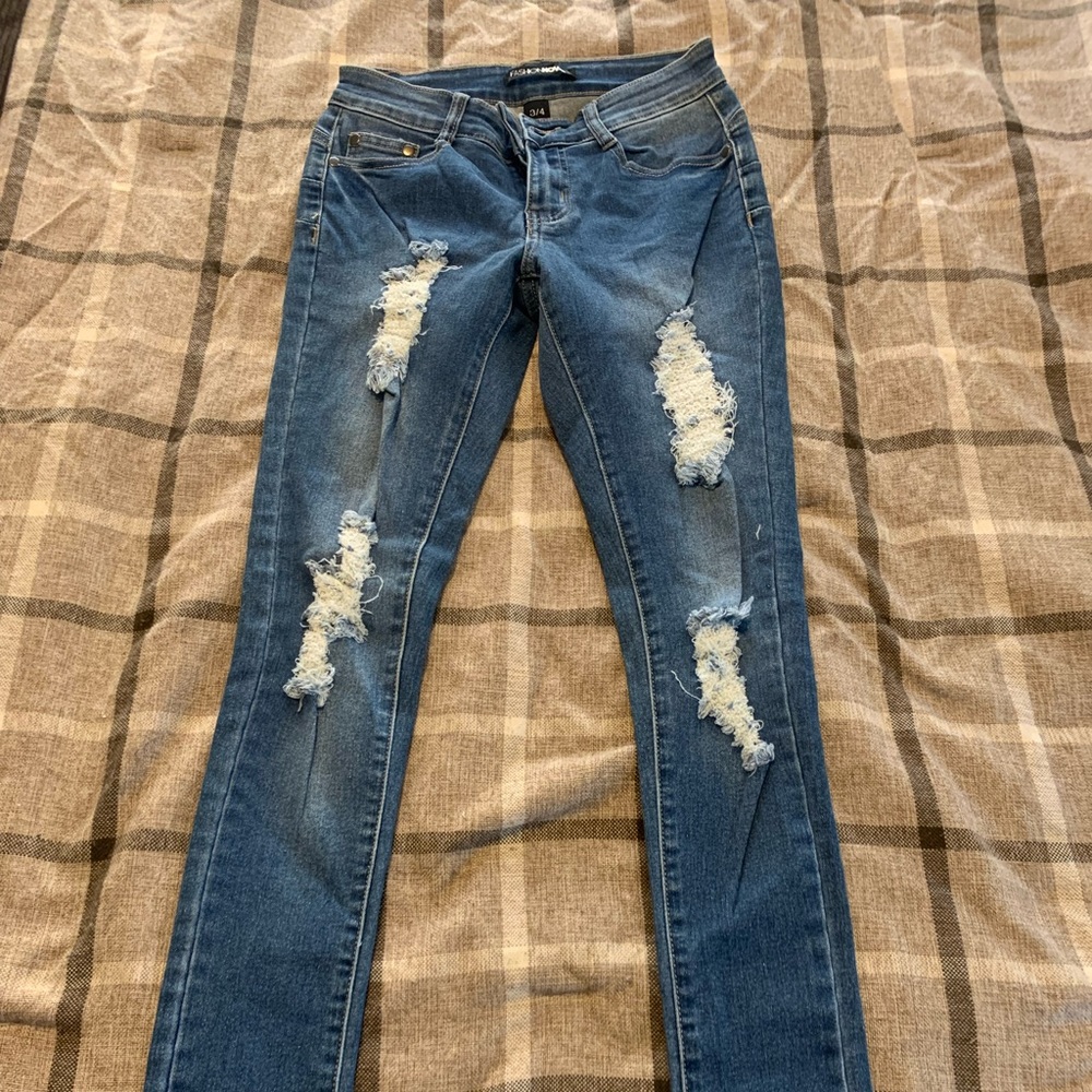 Fashion Nova Jeans. Worn once. Size 3/4 ripped jeans.